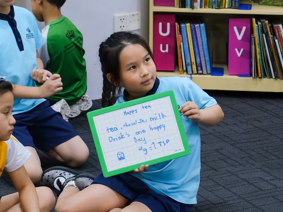 A student presenting an answer to the room